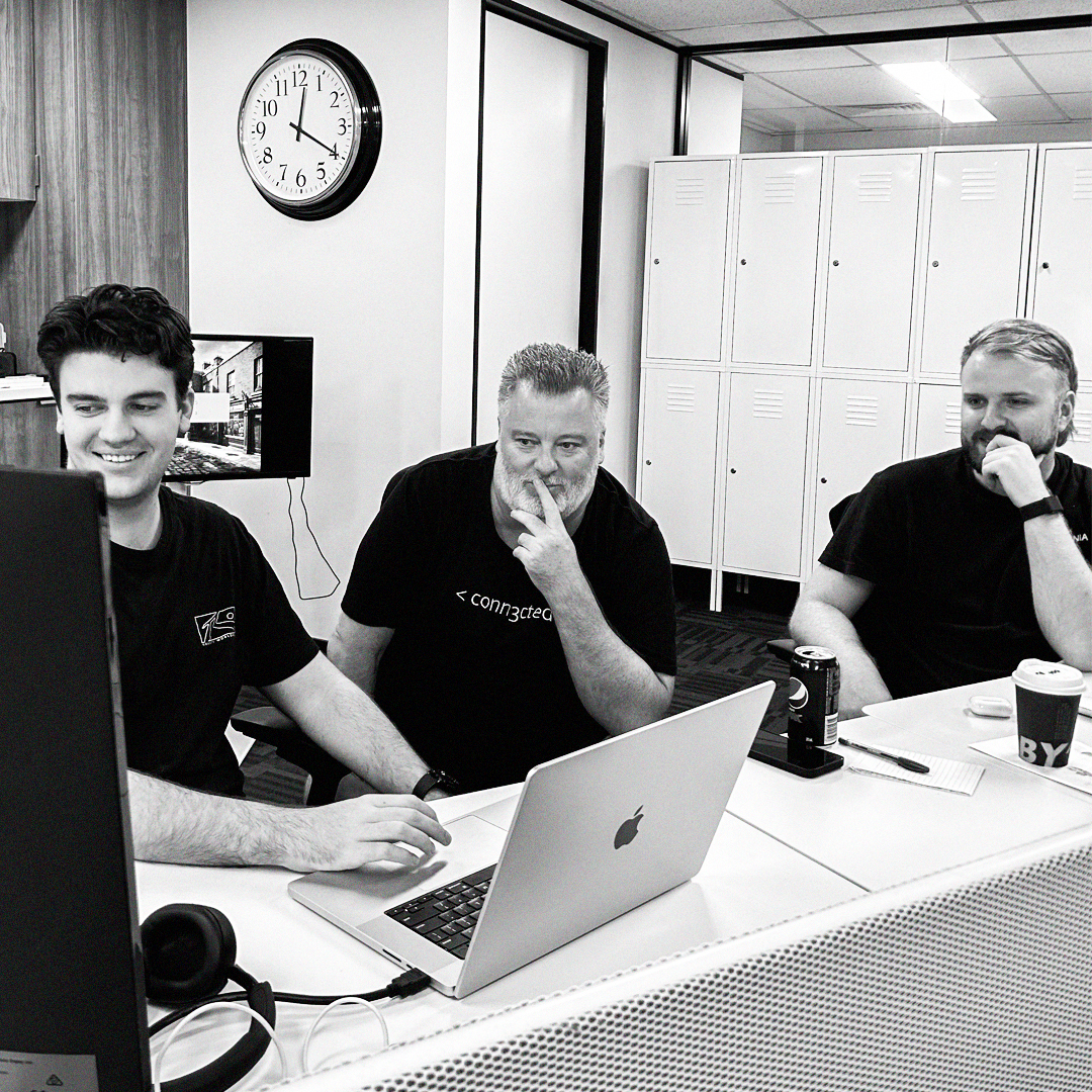 coworkers in front of laptop