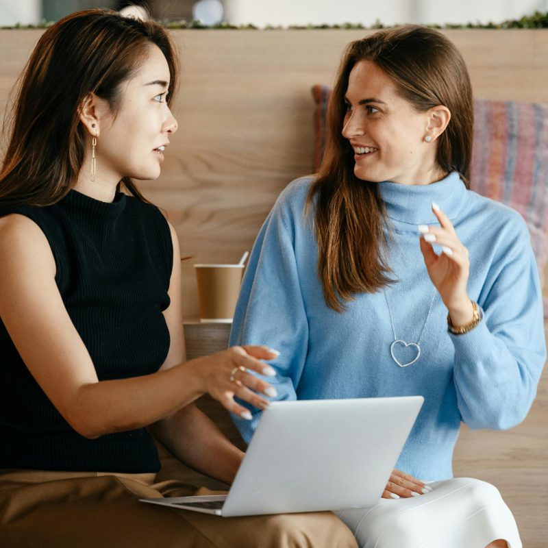 two women on laptop ecommerce online shopping